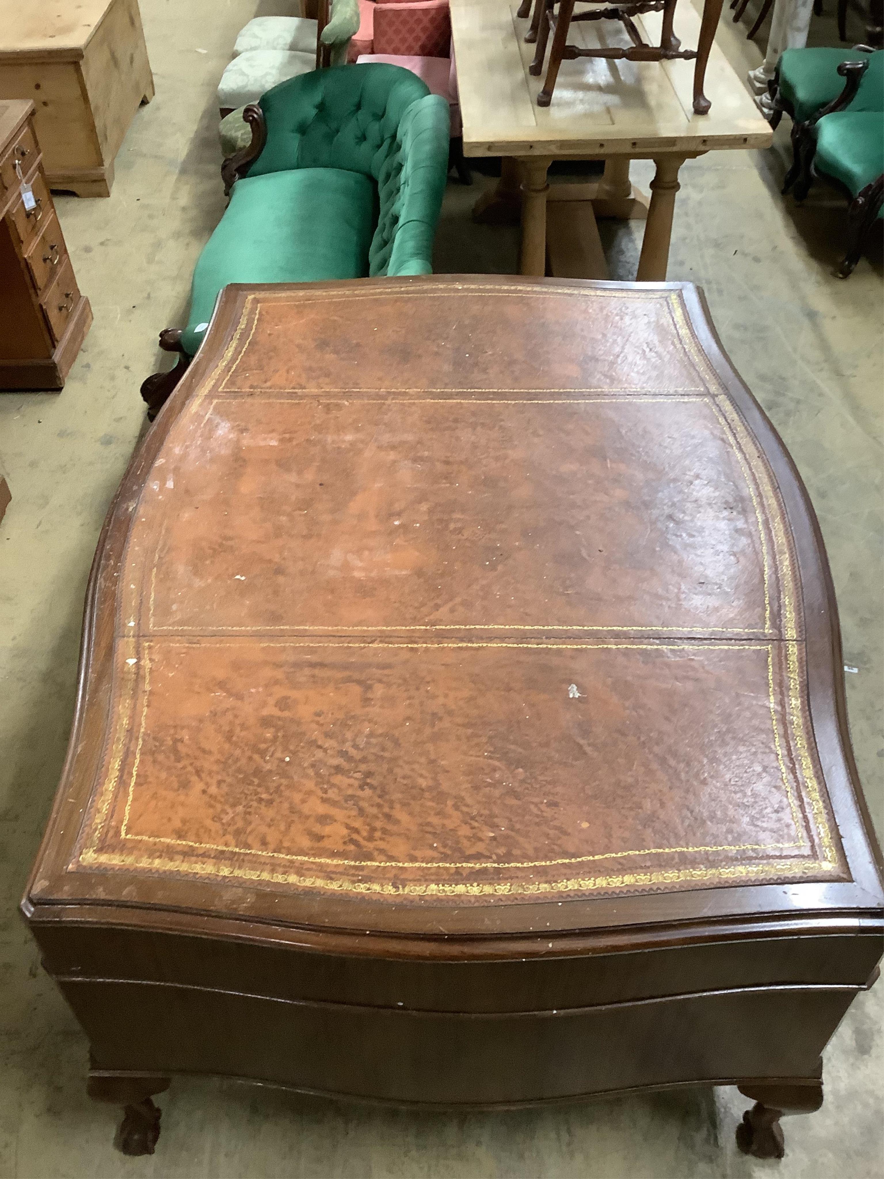 A Chippendale Revival mahogany serpentine partner's kneehole writing desk, width 152cm, depth 118cm, height 77cm. Condition - fair